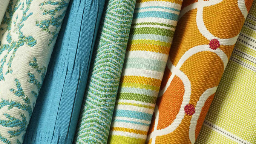 How do imitation silk fabrics provide a cost-effective sense of luxury in the fashion and home fields?